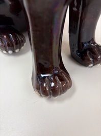 A Chinese sancai-glazed Xiezhi on a wooden stand, 19th C.