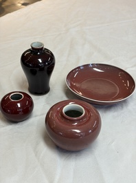 A Chinese copper-red-glazed plate, a meiping vase and two water pots, Kangxi marks, 19/20th C.