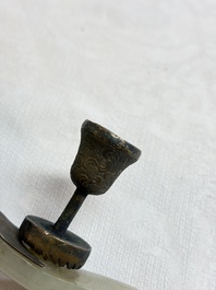 A Chinese celadon jade belt hook mounted as a handle on a Canton enamel bowl, Qing