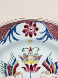 A pair of Chinese famille rose 'Winged Putti' plates, Yongzheng/Qianlong