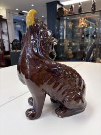 A Chinese sancai-glazed Xiezhi on a wooden stand, 19th C.