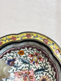 A Chinese celadon jade belt hook mounted as a handle on a Canton enamel bowl, Qing