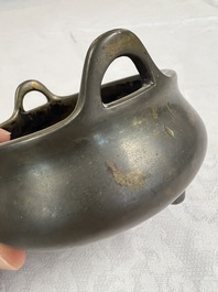 A Chinese bronze two-handled tripod censer, Xuande mark, 19th C.