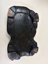 A Chinese sancai-glazed Xiezhi on a wooden stand, 19th C.