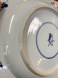 A large Chinese blue and white armorial dish with the arms of Pelgrom for the Dutch market, Kangxi