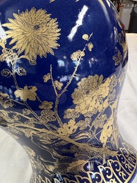 A Chinese gilt-decorated powder-blue-ground vase and cover, Kangxi mark, 19th C.