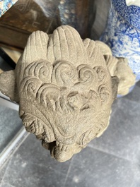 A pair of Chinese carved stone Buddhist lions on later red-lacquered wooden stands, Fujian, Qing