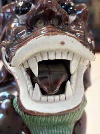 A Chinese sancai-glazed Xiezhi on a wooden stand, 19th C.