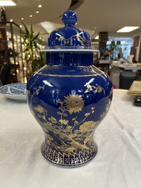 A Chinese gilt-decorated powder-blue-ground vase and cover, Kangxi mark, 19th C.