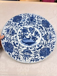 A large Chinese blue and white armorial dish with the arms of Pelgrom for the Dutch market, Kangxi