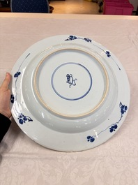 A large Chinese blue and white armorial dish with the arms of Pelgrom for the Dutch market, Kangxi