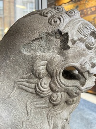A pair of Chinese carved stone Buddhist lions on later red-lacquered wooden stands, Fujian, Qing