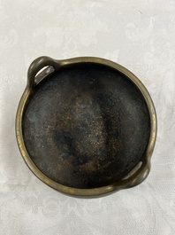 A Chinese bronze two-handled tripod censer, Xuande mark, 19th C.