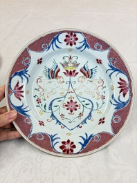 A pair of Chinese famille rose 'Winged Putti' plates, Yongzheng/Qianlong