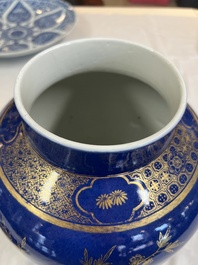 A Chinese gilt-decorated powder-blue-ground vase and cover, Kangxi mark, 19th C.