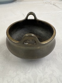 A Chinese bronze two-handled tripod censer, Xuande mark, 19th C.