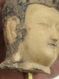 A rare Chinese polychrome carved white marble head of a Bodhisattva on a stand, Northern Qi