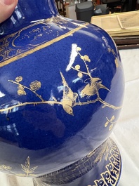 A Chinese gilt-decorated powder-blue-ground vase and cover, Kangxi mark, 19th C.