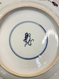 A large Chinese blue and white armorial dish with the arms of Pelgrom for the Dutch market, Kangxi