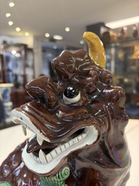 A Chinese sancai-glazed Xiezhi on a wooden stand, 19th C.