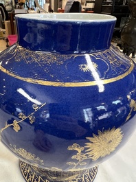 A Chinese gilt-decorated powder-blue-ground vase and cover, Kangxi mark, 19th C.
