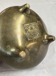 A Chinese bronze two-handled tripod censer, Xuande mark, 19th C.