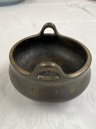 A Chinese bronze two-handled tripod censer, Xuande mark, 19th C.