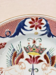 A pair of Chinese famille rose 'Winged Putti' plates, Yongzheng/Qianlong