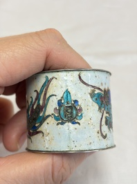 A Chinese enamelled silver 'Dragon' napkin ring, a pair of silver buckles and a pair of cloisonn&eacute; buckles, 19/20th C.