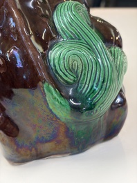 A Chinese sancai-glazed Xiezhi on a wooden stand, 19th C.