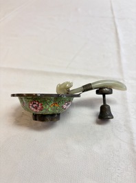 A Chinese celadon jade belt hook mounted as a handle on a Canton enamel bowl, Qing