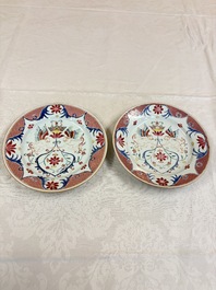 A pair of Chinese famille rose 'Winged Putti' plates, Yongzheng/Qianlong