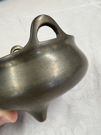 A Chinese bronze two-handled tripod censer, Xuande mark, 19th C.