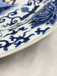 A large Chinese blue and white armorial dish with the arms of Pelgrom for the Dutch market, Kangxi