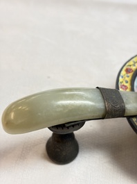 A Chinese celadon jade belt hook mounted as a handle on a Canton enamel bowl, Qing