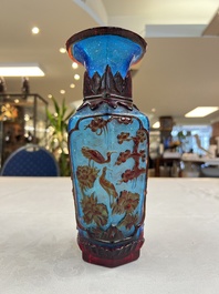 A Chinese red-overlay blue glass 'Cranes' hexagonal vase, Qianlong mark and of the period