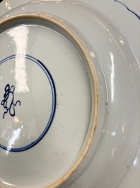 A large Chinese blue and white armorial dish with the arms of Pelgrom for the Dutch market, Kangxi