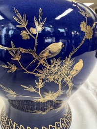 A Chinese gilt-decorated powder-blue-ground vase and cover, Kangxi mark, 19th C.