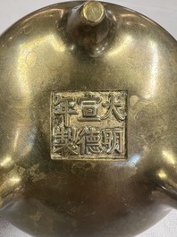 A Chinese bronze two-handled tripod censer, Xuande mark, 19th C.