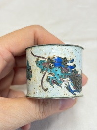 A Chinese enamelled silver 'Dragon' napkin ring, a pair of silver buckles and a pair of cloisonn&eacute; buckles, 19/20th C.