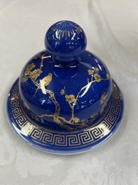 A Chinese gilt-decorated powder-blue-ground vase and cover, Kangxi mark, 19th C.