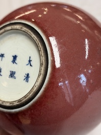 A Chinese copper-red-glazed plate, a meiping vase and two water pots, Kangxi marks, 19/20th C.