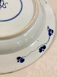 A large Chinese blue and white armorial dish with the arms of Pelgrom for the Dutch market, Kangxi