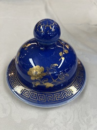 A Chinese gilt-decorated powder-blue-ground vase and cover, Kangxi mark, 19th C.