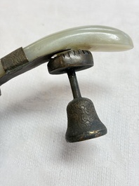 A Chinese celadon jade belt hook mounted as a handle on a Canton enamel bowl, Qing