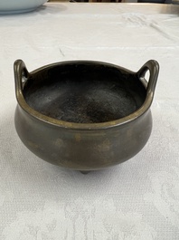 A Chinese bronze two-handled tripod censer, Xuande mark, 19th C.