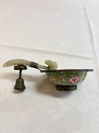 A Chinese celadon jade belt hook mounted as a handle on a Canton enamel bowl, Qing