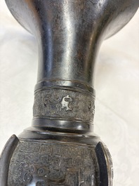 A pair of Chinese archaistic bronze 'Gu' vases, 18th C.