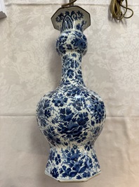 A pair of blue and white Dutch Delft garlic-head vases mounted as lamps, 18th C.