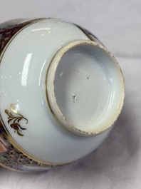 A pair of Chinese Canton famille rose cups and saucers with figural design, Daoguang